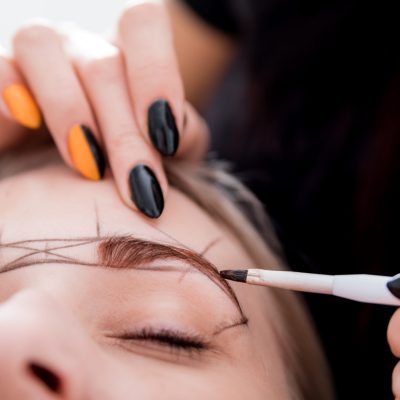 Permanent make up on eyebrows at beauty salon